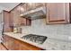 Close up of a gourmet kitchen with stainless steel range and granite countertops at 4892 Kentwood Dr, Marietta, GA 30068