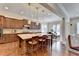 Spacious kitchen features an island, granite countertops, wooden cabinets, and stainless steel appliances at 4892 Kentwood Dr, Marietta, GA 30068