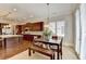 Bright eat-in kitchen with cherry cabinets, granite counters, an island, and stainless steel appliances at 4892 Kentwood Dr, Marietta, GA 30068