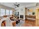 Spacious living room features a fireplace, hardwood floors, and comfortable leather furniture at 4892 Kentwood Dr, Marietta, GA 30068