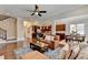 Bright living room with access to the kitchen and featuring hardwood floors, a ceiling fan, and comfortable seating at 4892 Kentwood Dr, Marietta, GA 30068