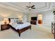The spacious primary suite features a tray ceiling, ceiling fan, and an attached bath at 4892 Kentwood Dr, Marietta, GA 30068