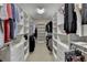 Spacious walk-in closet with custom shelving and drawers for optimal organization and storage at 4892 Kentwood Dr, Marietta, GA 30068