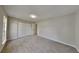 Bright bedroom featuring fresh carpet and a closet, offering a comfortable living space at 5326 Nader Pl, Stone Mountain, GA 30088