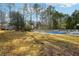 The expansive backyard has a spacious lawn and a covered in-ground pool at 360 Wynbrook Dr, Mcdonough, GA 30253