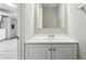 This bathroom includes a modern sink and a mirror in a well-lit space at 360 Wynbrook Dr, Mcdonough, GA 30253