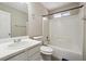 Bathroom featuring white fixtures and a shower-tub combo at 360 Wynbrook Dr, Mcdonough, GA 30253