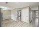 Open dining area with modern lighting fixtures and wood flooring at 360 Wynbrook Dr, Mcdonough, GA 30253