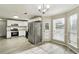 Spacious kitchen with stainless steel appliances, white cabinets, and natural light at 360 Wynbrook Dr, Mcdonough, GA 30253