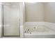 Clean main bathroom featuring a separate shower and tub at 360 Wynbrook Dr, Mcdonough, GA 30253