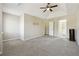 Spacious main bedroom featuring tray ceiling and access to the main bathroom at 360 Wynbrook Dr, Mcdonough, GA 30253
