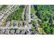 Aerial view showcasing property in a well-planned neighborhood with mature trees, yellow property outline shown at 556 Georgia Cir, Loganville, GA 30052
