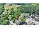Aerial view of the home and surrounding neighborhood with lush green trees at 556 Georgia Cir, Loganville, GA 30052