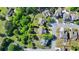 Aerial view of home with well-kept lawn and mature trees, highlighted with yellow property outline at 556 Georgia Cir, Loganville, GA 30052