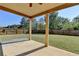 Green backyard featuring a patio and a well-kept wooden fence at 556 Georgia Cir, Loganville, GA 30052