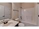 Well-lit bathroom featuring a shower-tub combination, neutral walls, and dark bronze hardware at 556 Georgia Cir, Loganville, GA 30052