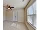 Well-lit room with large window and a double-door closet with a view of the ceiling fan at 556 Georgia Cir, Loganville, GA 30052