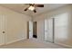 Bedroom features carpet flooring, neutral walls, and a ceiling fan at 556 Georgia Cir, Loganville, GA 30052