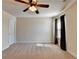Bedroom featuring a ceiling fan, natural light, and neutral carpeting at 556 Georgia Cir, Loganville, GA 30052
