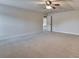 Bonus room with neutral carpet, lots of space, and a ceiling fan at 556 Georgia Cir, Loganville, GA 30052