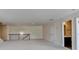 Spacious bonus room featuring carpeted floors, recessed lighting, and staircase with railing and bathroom access at 556 Georgia Cir, Loganville, GA 30052