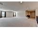 Spacious bonus room featuring carpeted floors, recessed lighting, and multiple windows at 556 Georgia Cir, Loganville, GA 30052