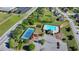 An aerial view of community amenities, featuring a sparkling pool and tennis courts at 556 Georgia Cir, Loganville, GA 30052