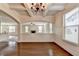 Bright dining room featuring a coffered ceiling and wood floors at 556 Georgia Cir, Loganville, GA 30052
