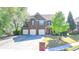 Charming brick home featuring a three-car garage and well-maintained landscaping at 556 Georgia Cir, Loganville, GA 30052