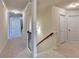Light and bright hallway with neutral color scheme, trimmed doorways, and neutral carpet at 556 Georgia Cir, Loganville, GA 30052
