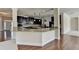 Stylish kitchen with granite counters, stainless steel appliances, and seamless flow into the adjacent living area at 556 Georgia Cir, Loganville, GA 30052