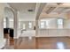 Open-concept living room showcases hardwood floors and access to the gourmet kitchen at 556 Georgia Cir, Loganville, GA 30052