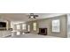 Open floor plan with kitchen, living room with fireplace, and hardwood flooring at 556 Georgia Cir, Loganville, GA 30052