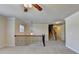 Neutral, carpeted loft area with views to the staircase and natural light from windows at 556 Georgia Cir, Loganville, GA 30052