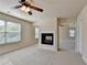 Spacious main bedroom features a central fireplace and large windows with natural light at 556 Georgia Cir, Loganville, GA 30052