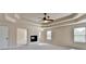 This spacious main bedroom includes a fireplace, ceiling fan, and ample natural light at 556 Georgia Cir, Loganville, GA 30052