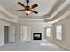 Large main bedroom with fireplace and lots of natural light has hallway leading to another part of the house at 556 Georgia Cir, Loganville, GA 30052