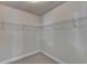 Walk-in closet featuring wire shelving and carpeted floors at 556 Georgia Cir, Loganville, GA 30052
