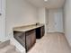 Wet bar featuring a dark sink and a light countertop at 556 Georgia Cir, Loganville, GA 30052
