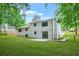 This property includes a spacious backyard with lush greenery and a well-maintained lawn at 7582 Carlisle Dr, Jonesboro, GA 30236