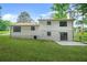 Expansive backyard featuring a well-maintained lawn and a charming exterior at 7582 Carlisle Dr, Jonesboro, GA 30236