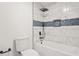 Updated bathroom with tiled shower and bathtub combination at 7582 Carlisle Dr, Jonesboro, GA 30236