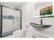 Bathroom with modern glass shower and decorative vessel sink at 7582 Carlisle Dr, Jonesboro, GA 30236