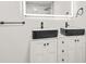 Updated bathroom featuring dual vessel sinks and a LED mirror at 7582 Carlisle Dr, Jonesboro, GA 30236