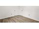 This bedroom features durable wood-look floors and double closets for ample storage at 7582 Carlisle Dr, Jonesboro, GA 30236