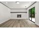Bright living room featuring a brick fireplace and sliding glass doors at 7582 Carlisle Dr, Jonesboro, GA 30236