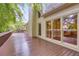 Large wooden deck with ample space, offering a view of the surrounding greenery at 9395 Clublands Dr, Alpharetta, GA 30022