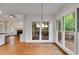 Dining area featuring natural light, access to a deck, and seamless transition to the living room at 9395 Clublands Dr, Alpharetta, GA 30022