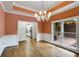 Open dining room with access to the patio and kitchen offers great natural light at 9395 Clublands Dr, Alpharetta, GA 30022