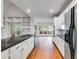 Modern kitchen featuring white cabinets, granite countertops, and stainless steel appliances at 9395 Clublands Dr, Alpharetta, GA 30022